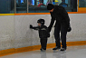 Young boy  learning to skate during Family Day